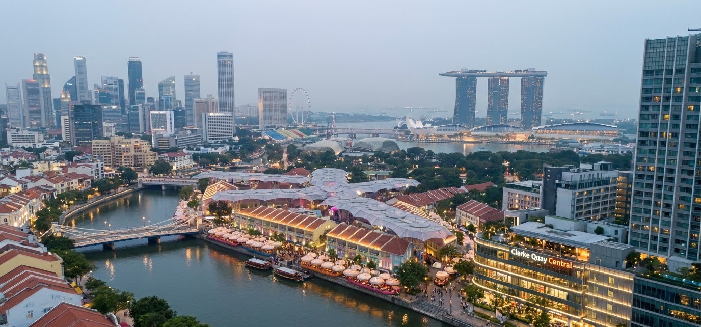 Aerial view of the Singapore River bend with Clarke Quay on the north bank and the CBD skyline behind Aerial view of the Singapore River bend with Clarke Quay on the north bank and the CBD skyline behind