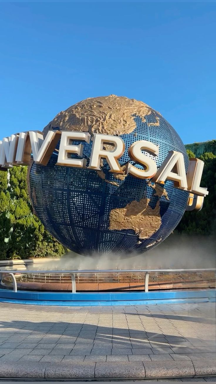 Universal Studios Japan iconic rotating globe landmark at park entrance in Osaka
