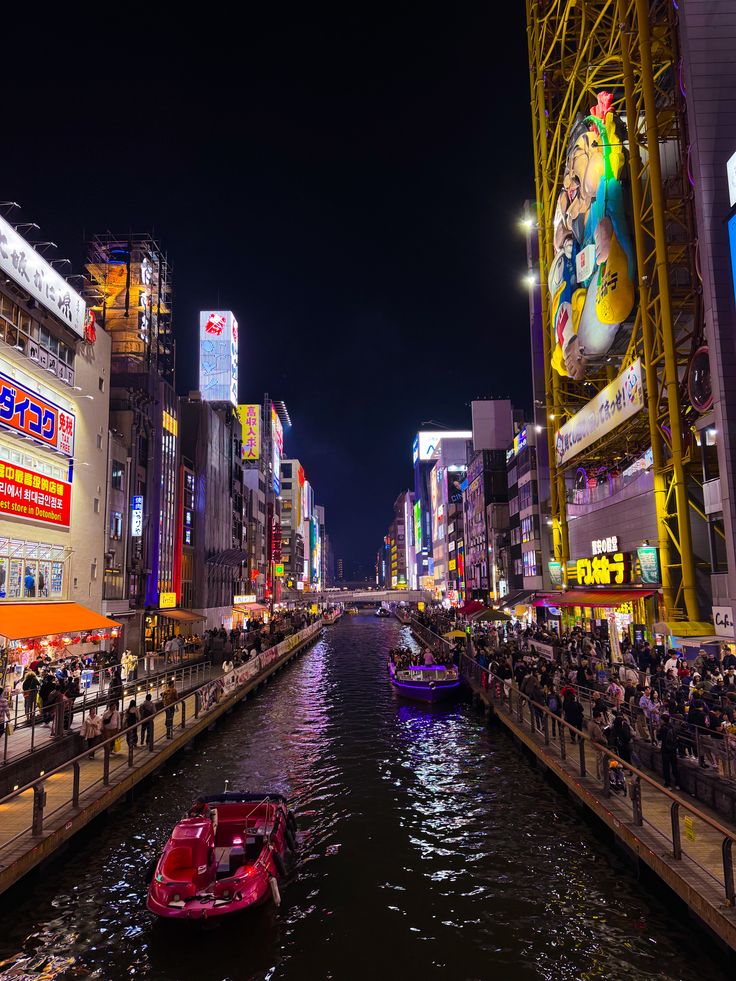 Bustling street of Dotonbori packed with vibrant food signs in Osaka Japan