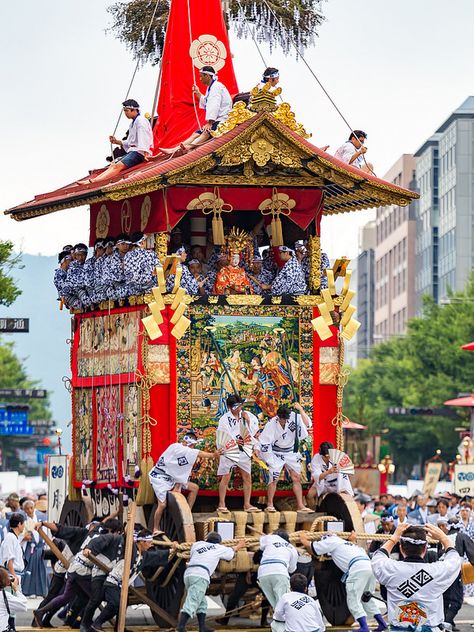 Massive wooden Yamaboko float procession during Gion Matsuri festival in Kyoto